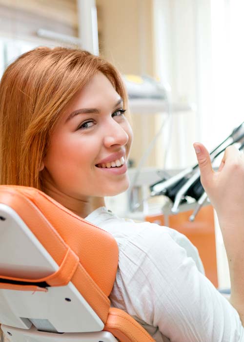 Girl at the Dentist Giving Thumbs Up